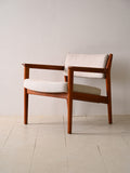 Poltrona imbottita con struttura in teak
