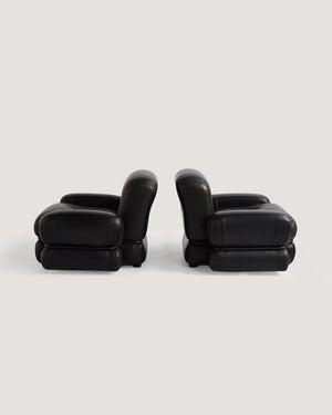 Poltrone in pelle nera e acciaio tubolare anni ’70